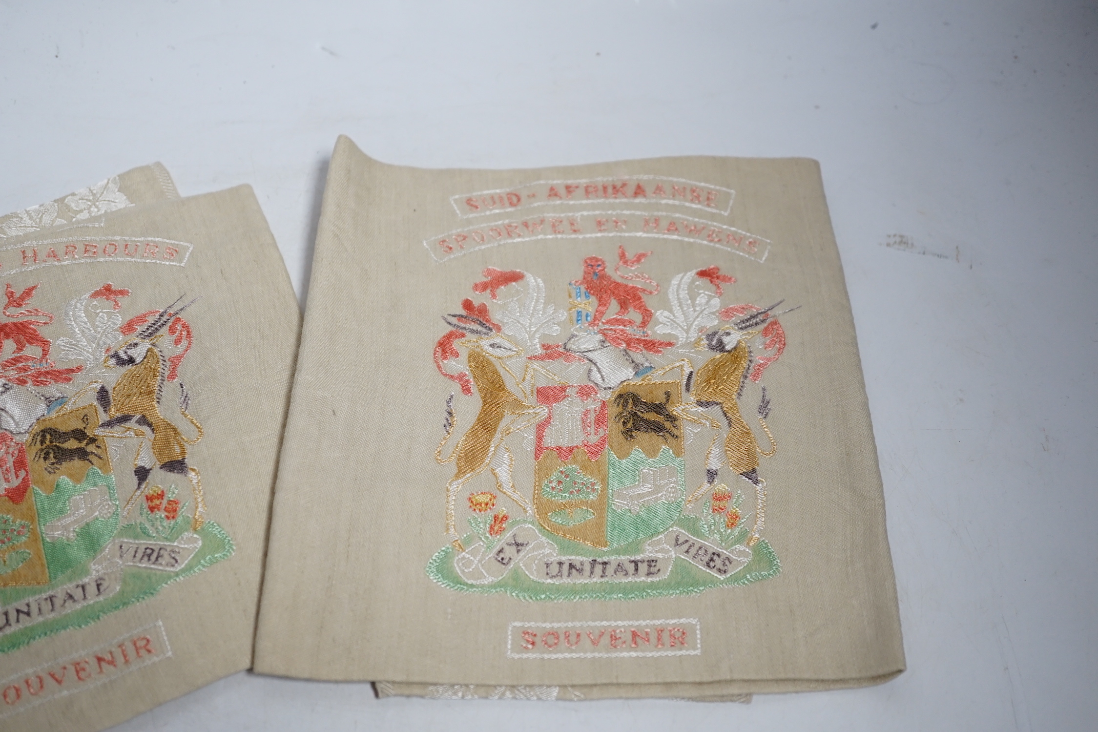Two South African late 19th century damask railway napkins and a velvet rugby or cricketing cap